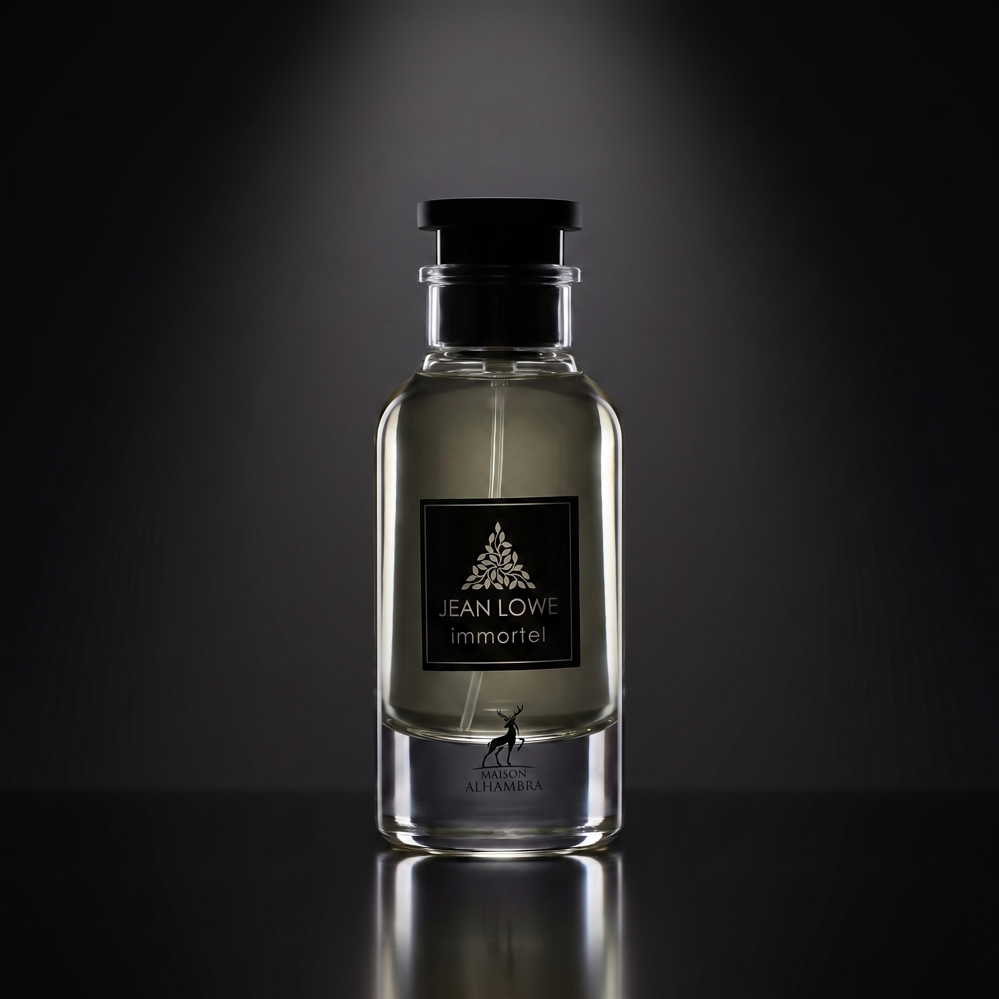 Maison Alhambra Jean Lowe Immortel — frasco sobre superficie negra reflectante con fondo carbón